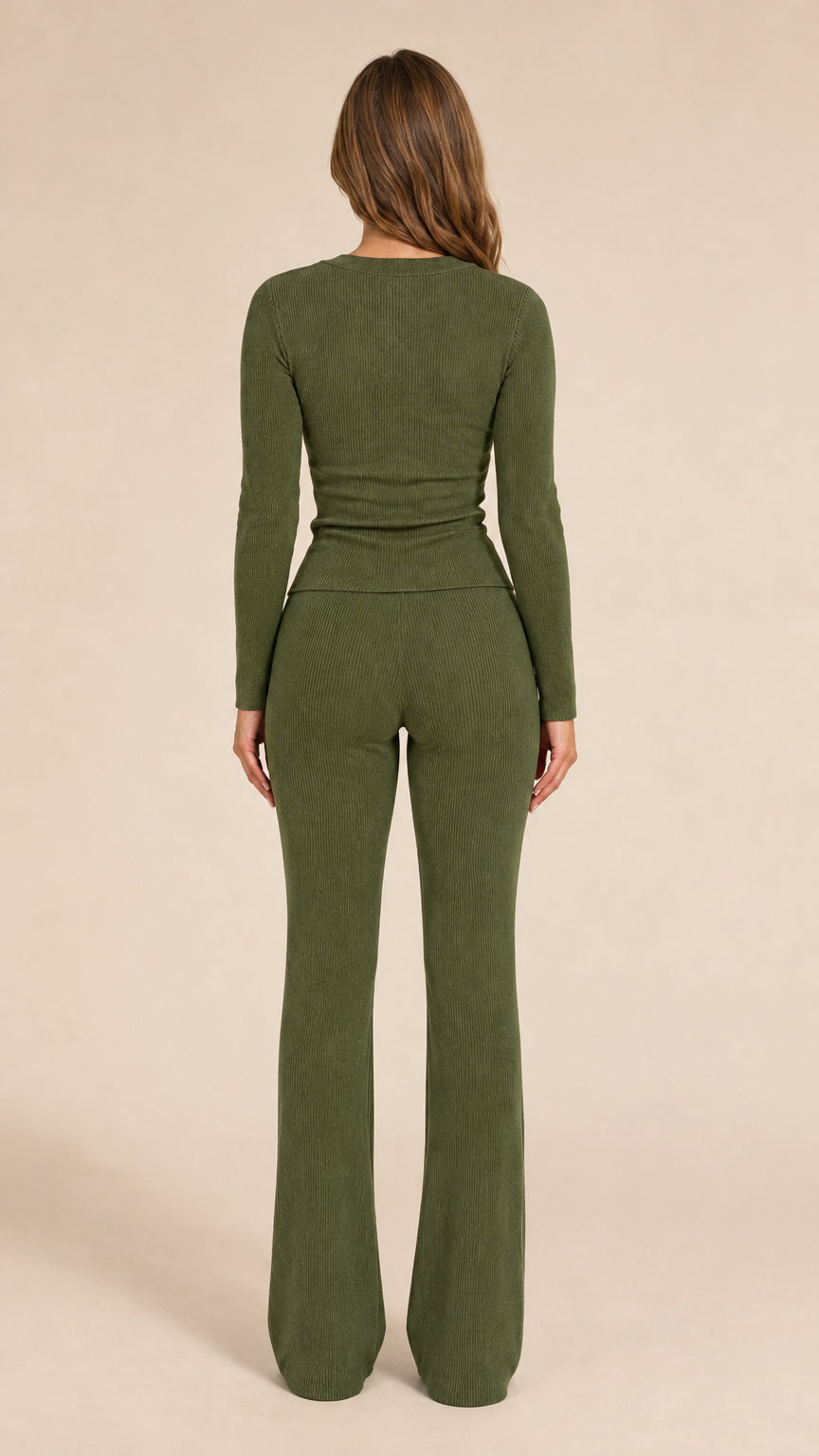 Back view of model in olive green long-sleeve knit cardigan and flared pants set