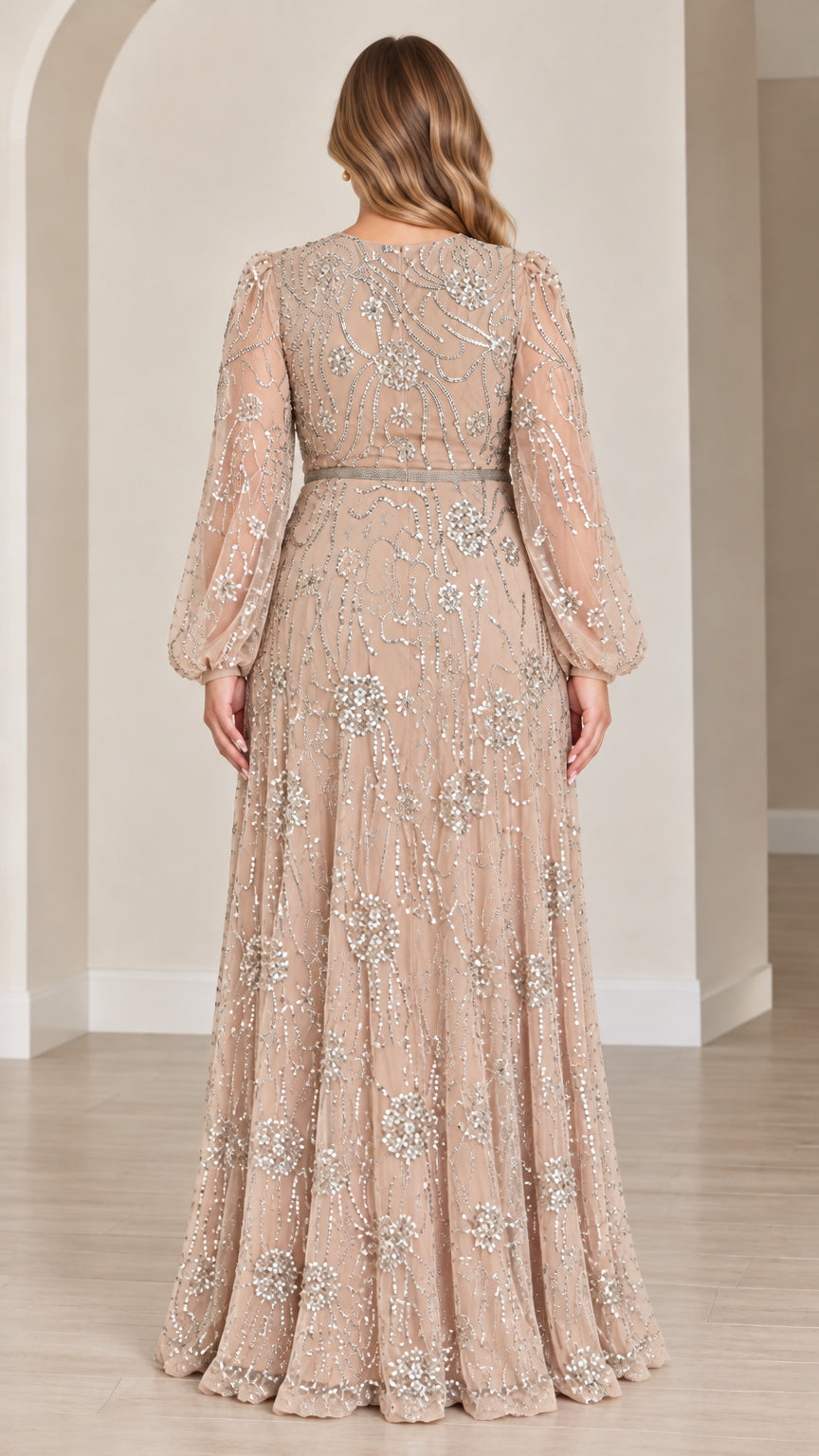 Back view of woman wearing champagne sequined evening gown with balloon sleeves