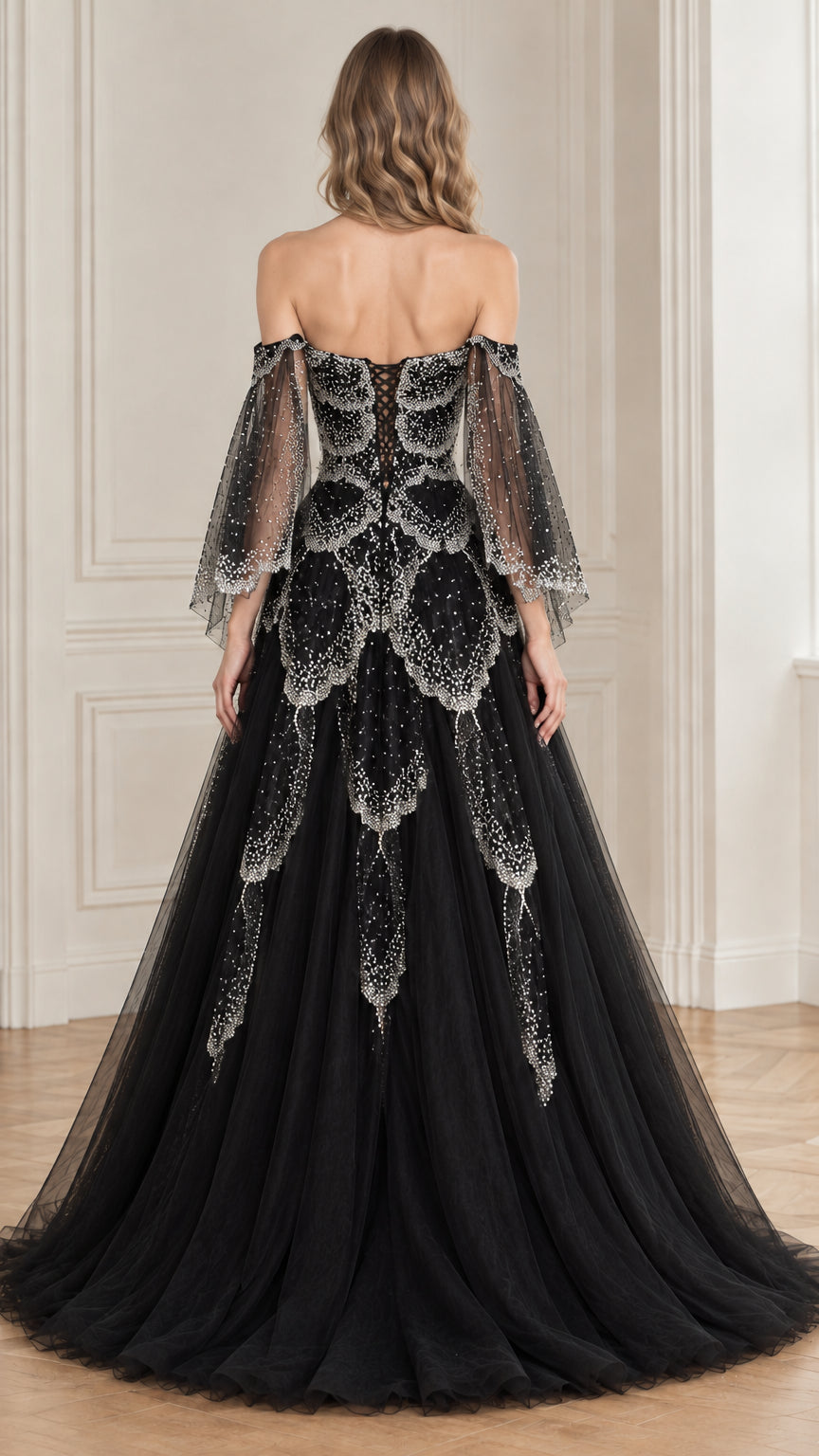 Back view of black ballgown showcasing lace-up corset back and cascading beading
