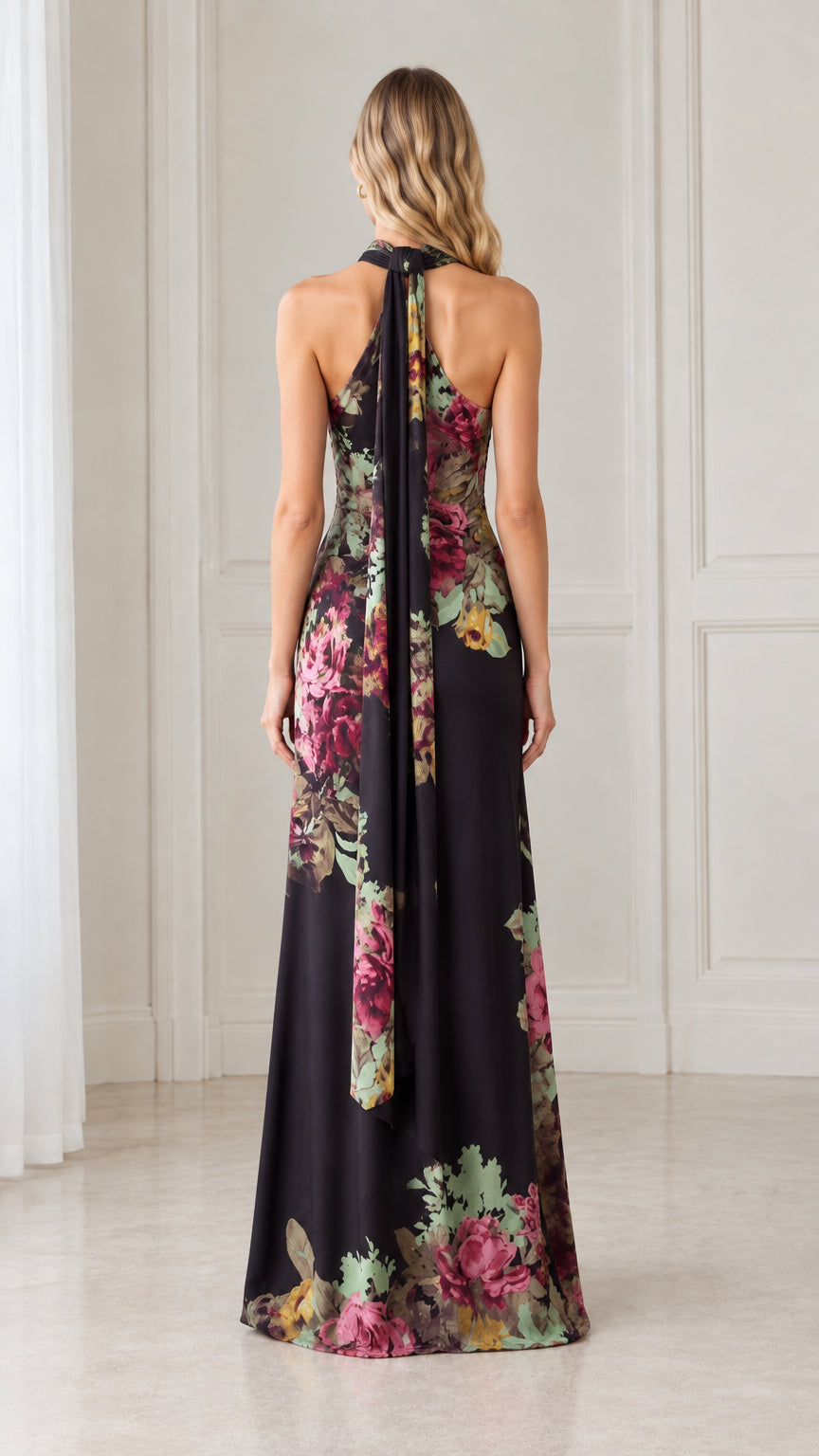 Back view of black floral sleeveless gown highlighting high neck and flowing back streamer