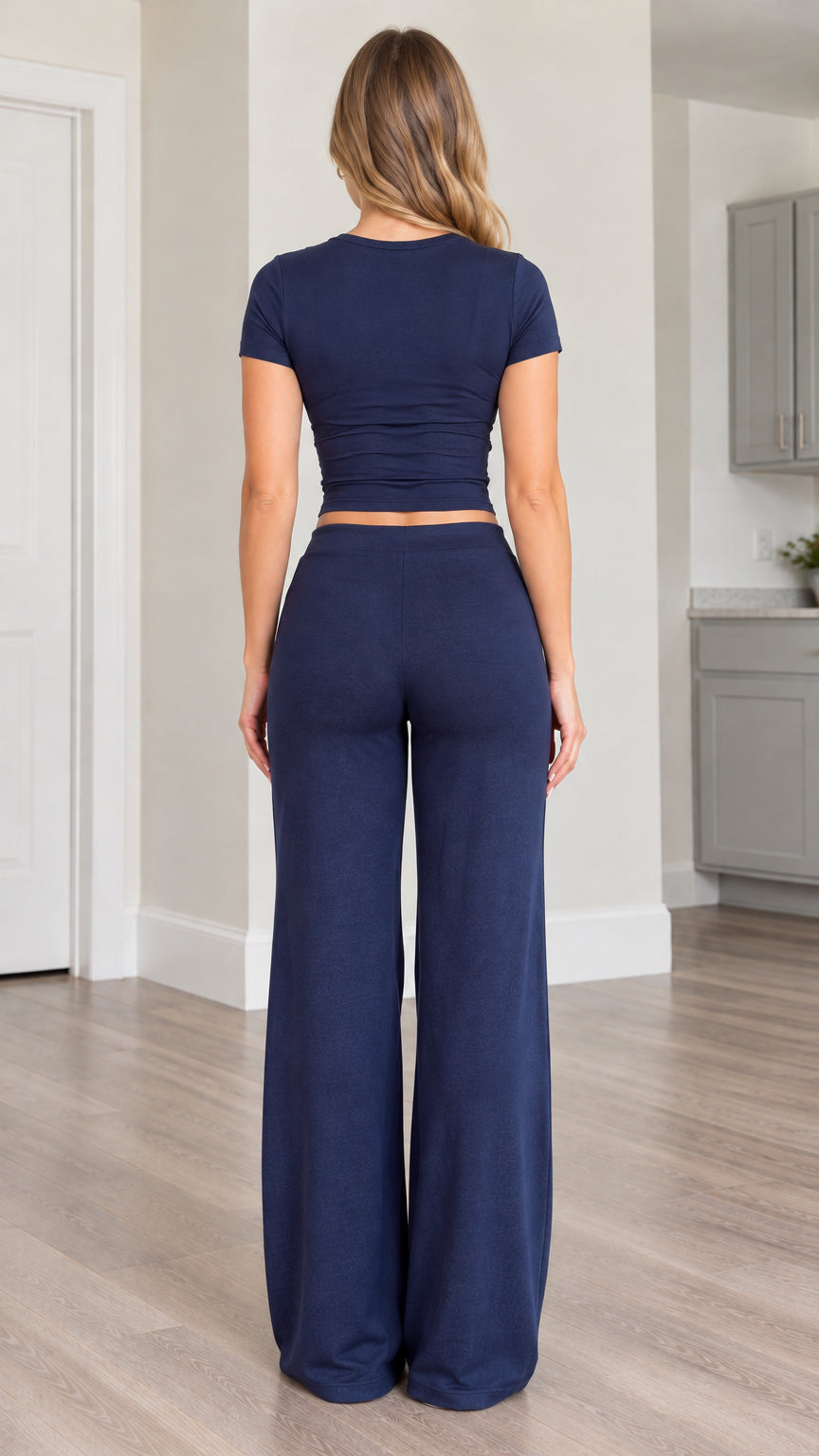 Back view of navy blue short-sleeve cropped tee and flowing wide-leg pants