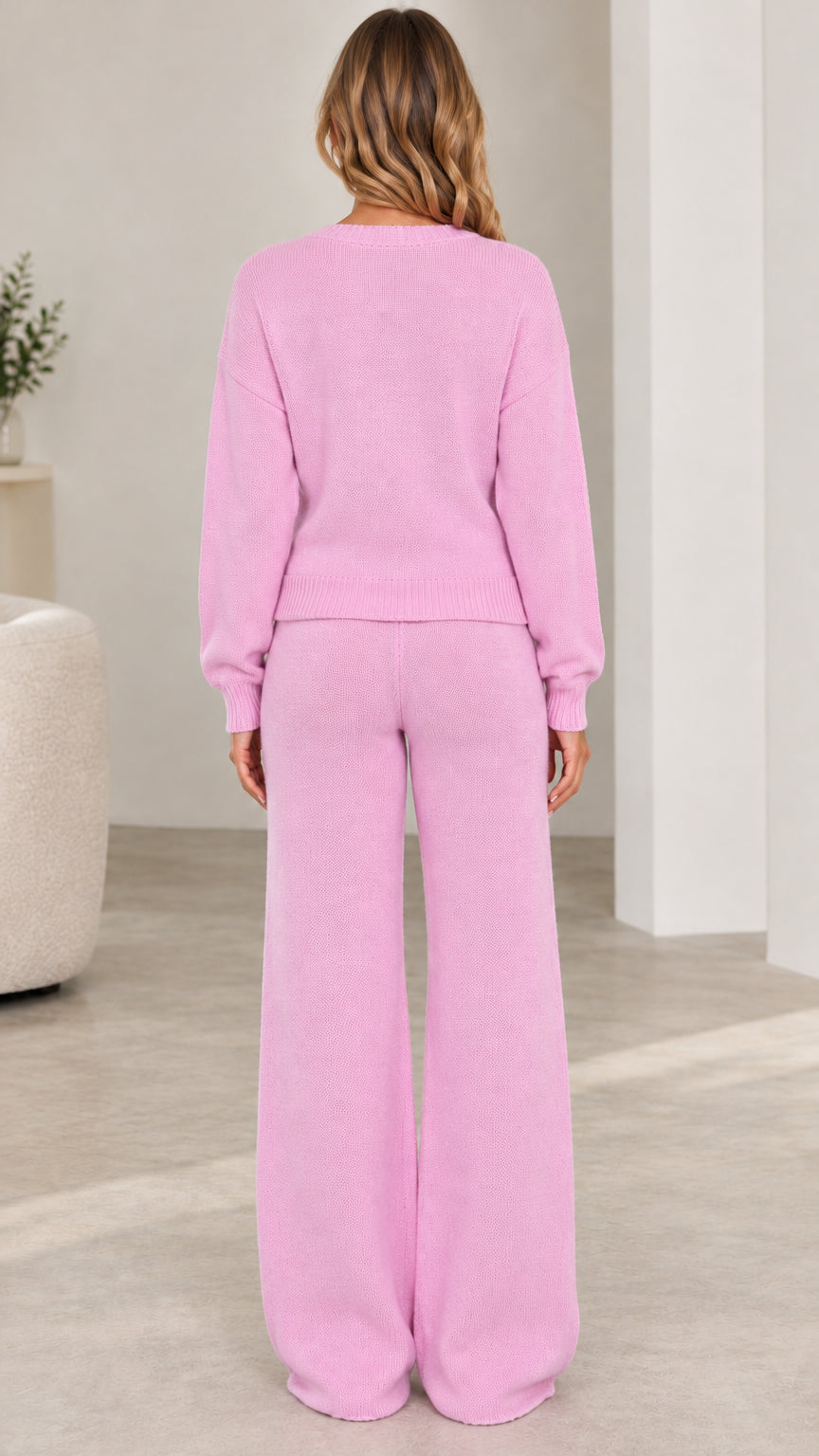 Back view of woman wearing pink two-piece knit lounge set