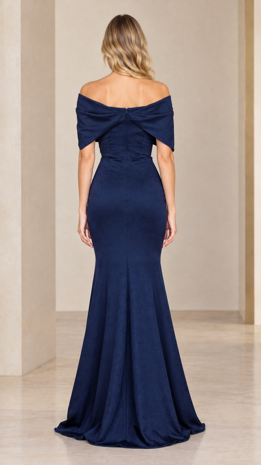 Back full-length view showing the concealed zipper and flared hem of the navy blue gown