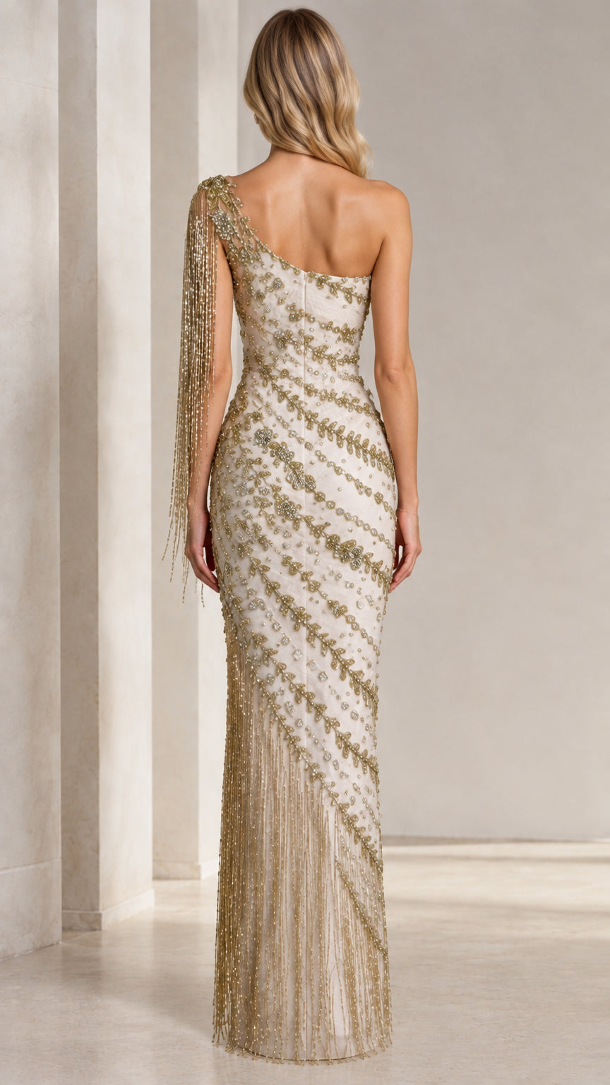 Back view of champagne one-shoulder formal gown with metallic beadwork