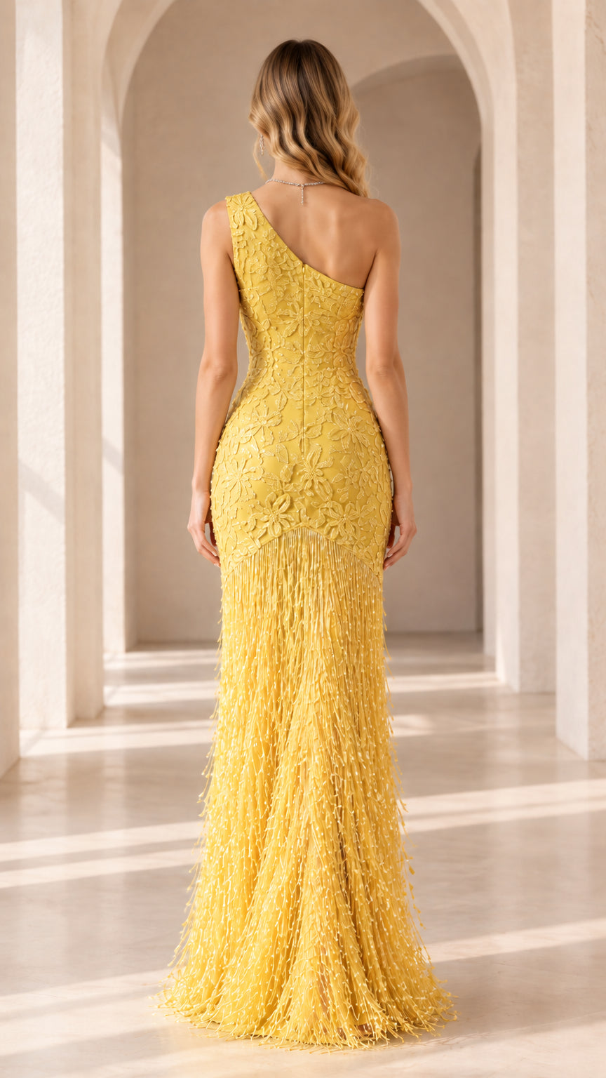 Back view of yellow one-shoulder sequin fringe evening dress with slit