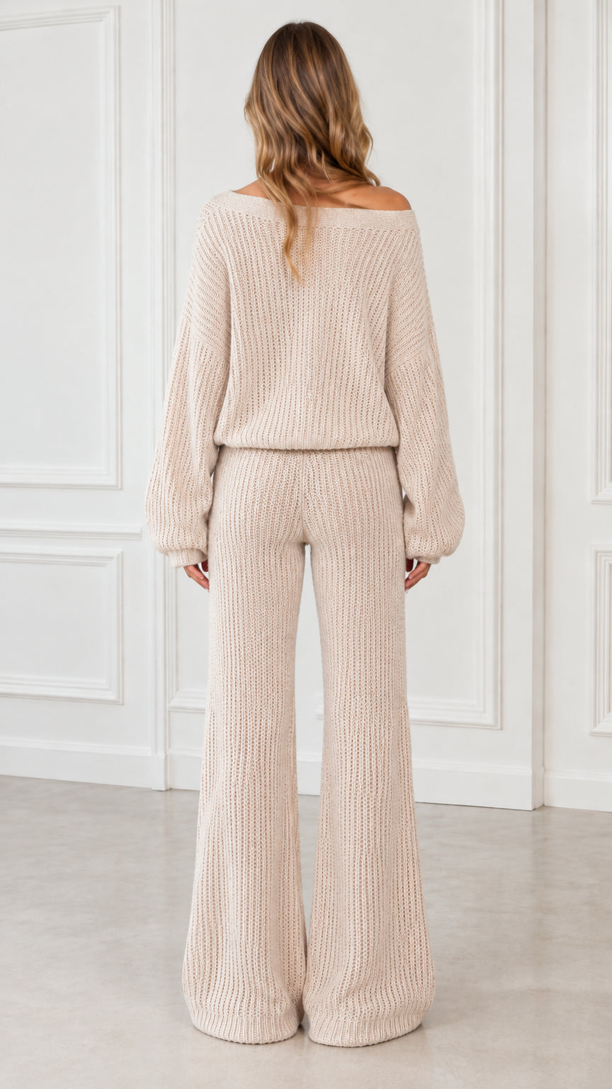 Back view of model showcasing beige knit lounge set with relaxed wide leg silhouette
