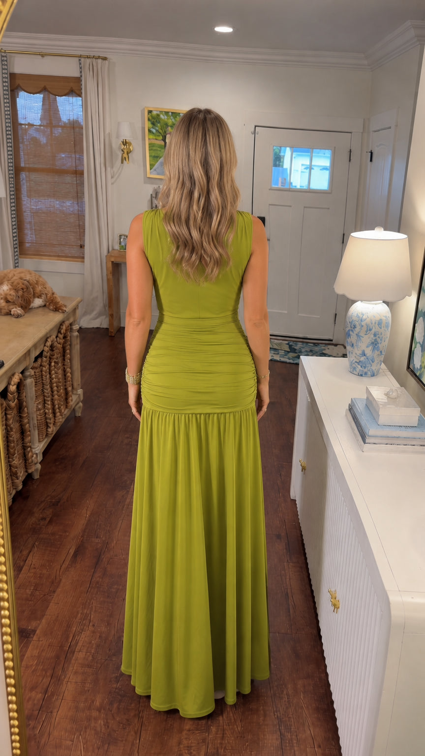Back view of model wearing olive green sleeveless maxi dress with ruched drop waist