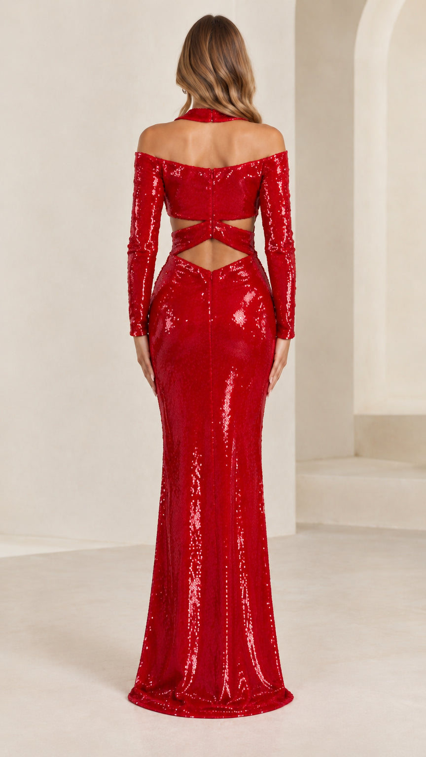 Back view of model in red sequin evening dress showing strappy cutout back details