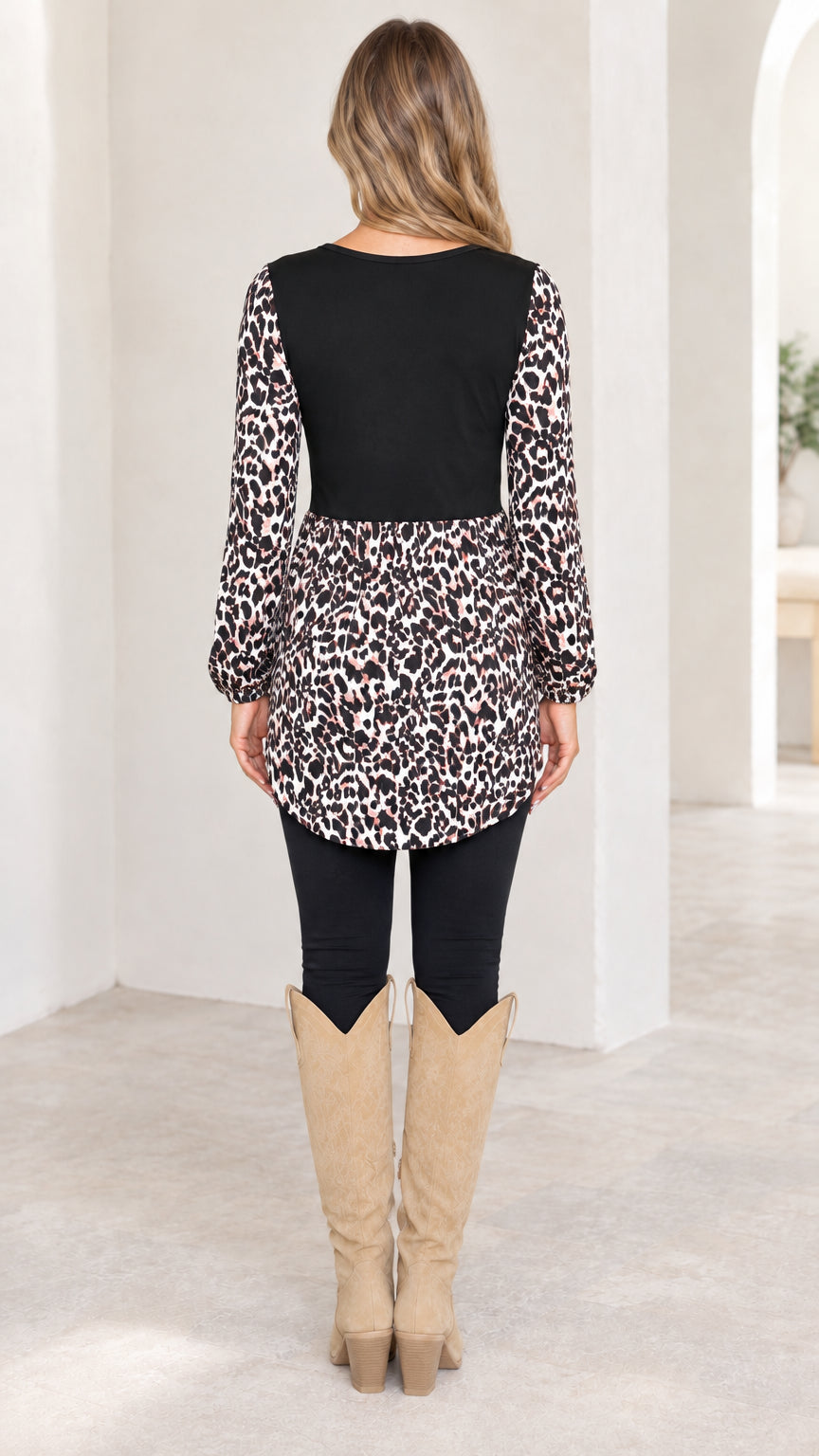 Back view of model wearing black long sleeve leopard babydoll tunic top