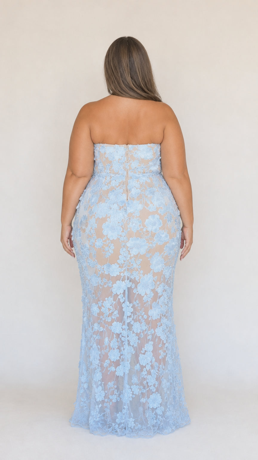 Back view of model wearing light blue strapless floral lace evening dress
