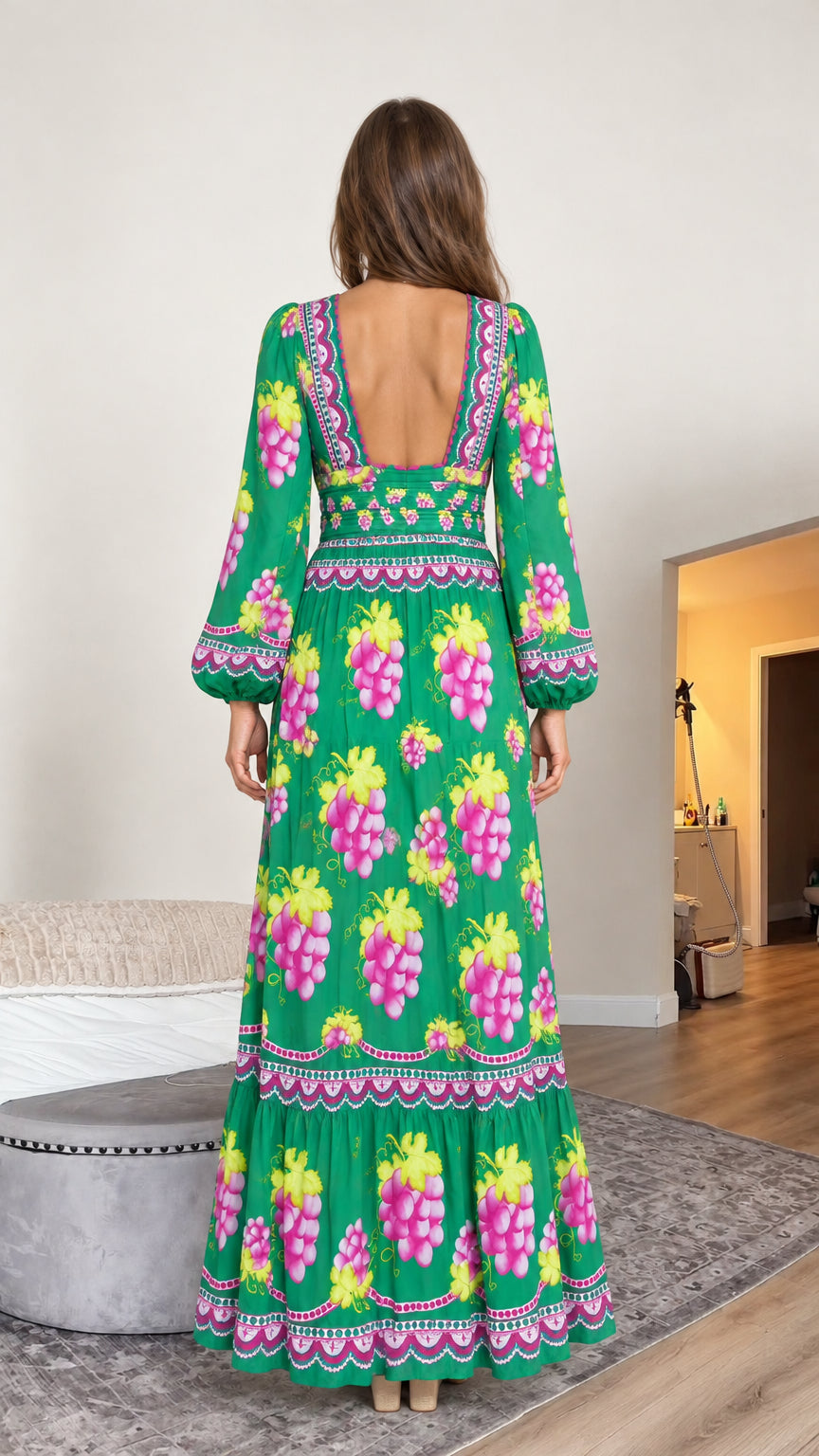 Back view of woman showing low back design on green grape print maxi dress