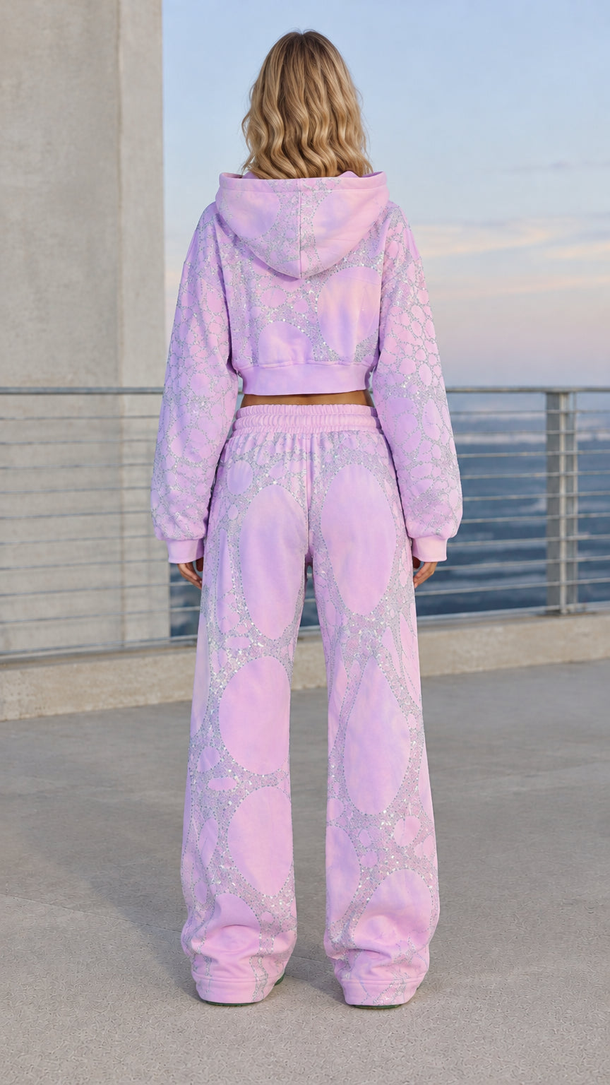 Back full view of woman wearing lavender rhinestone hooded tracksuit set