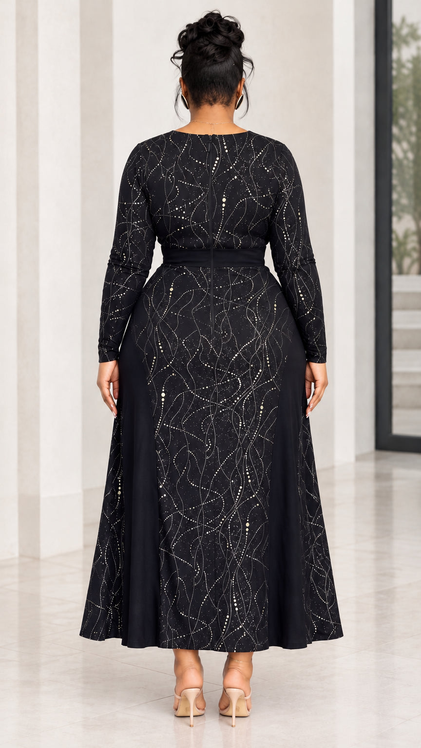 Back view of model wearing black long sleeve flared evening maxi dress