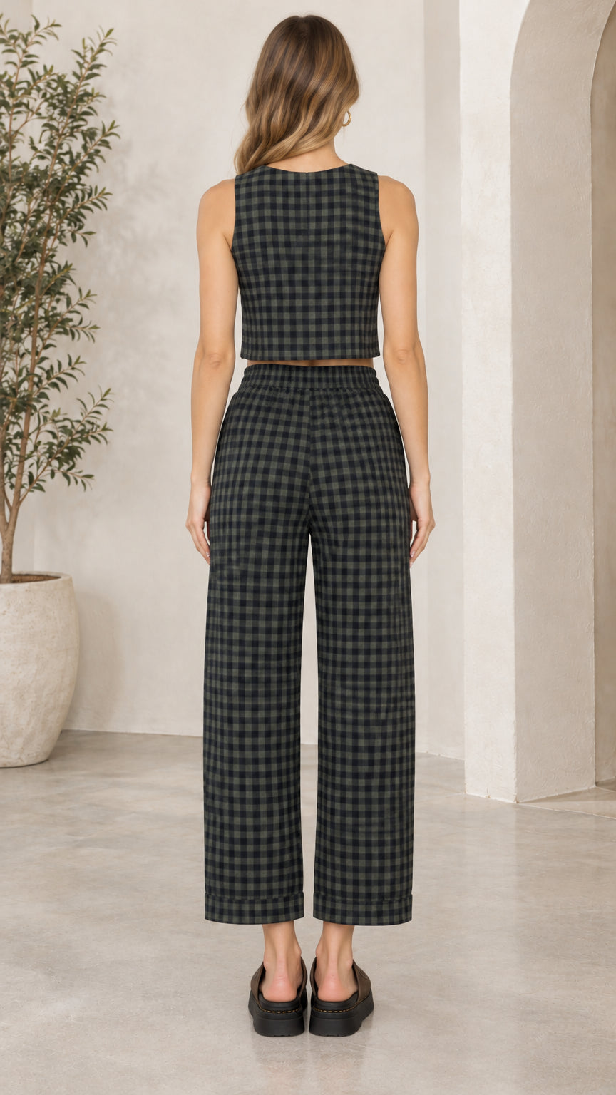 Back view of model wearing dark green gingham crop top and elastic-waist pants set
