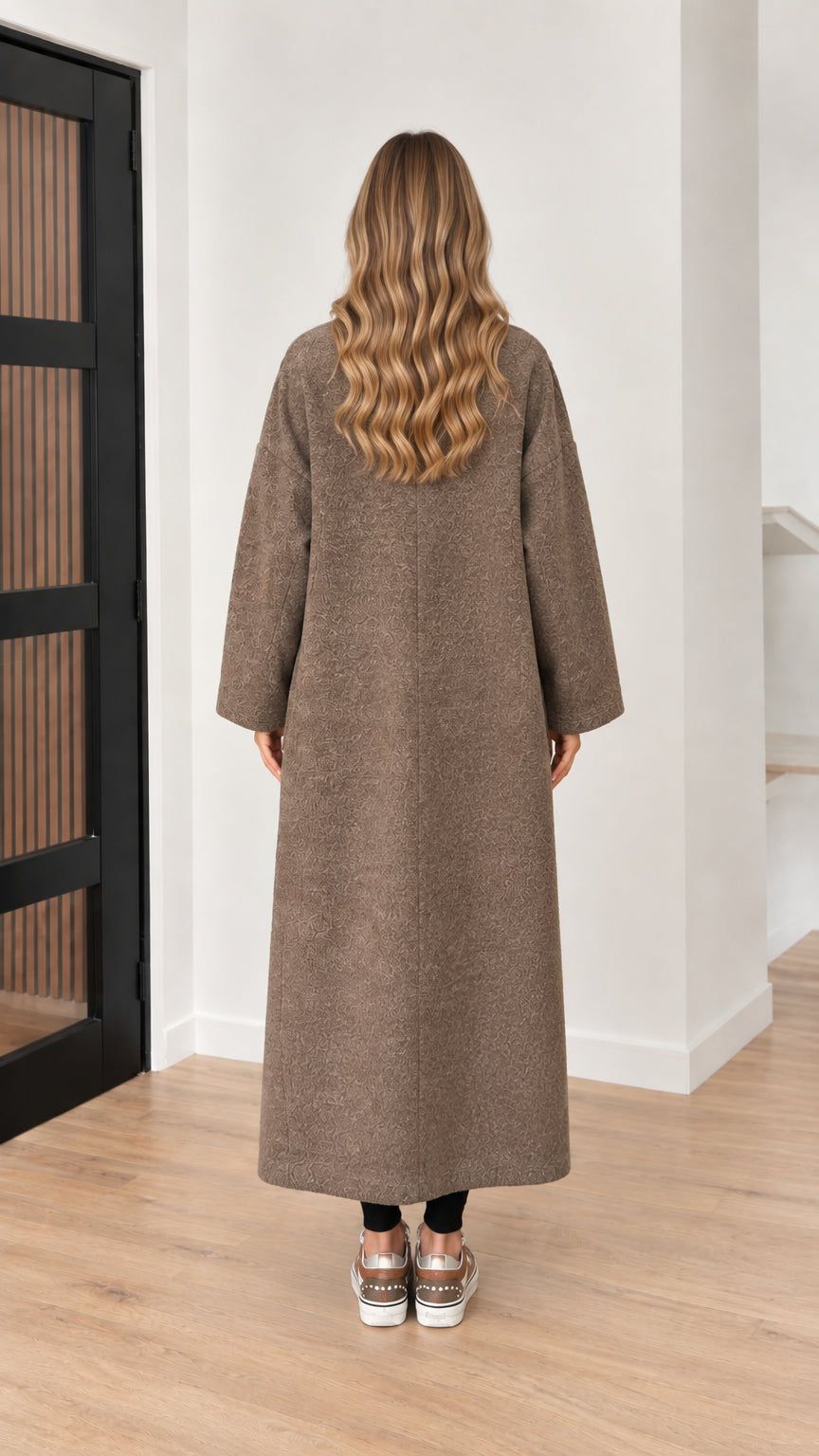 Back view of model wearing taupe brown textured long coat