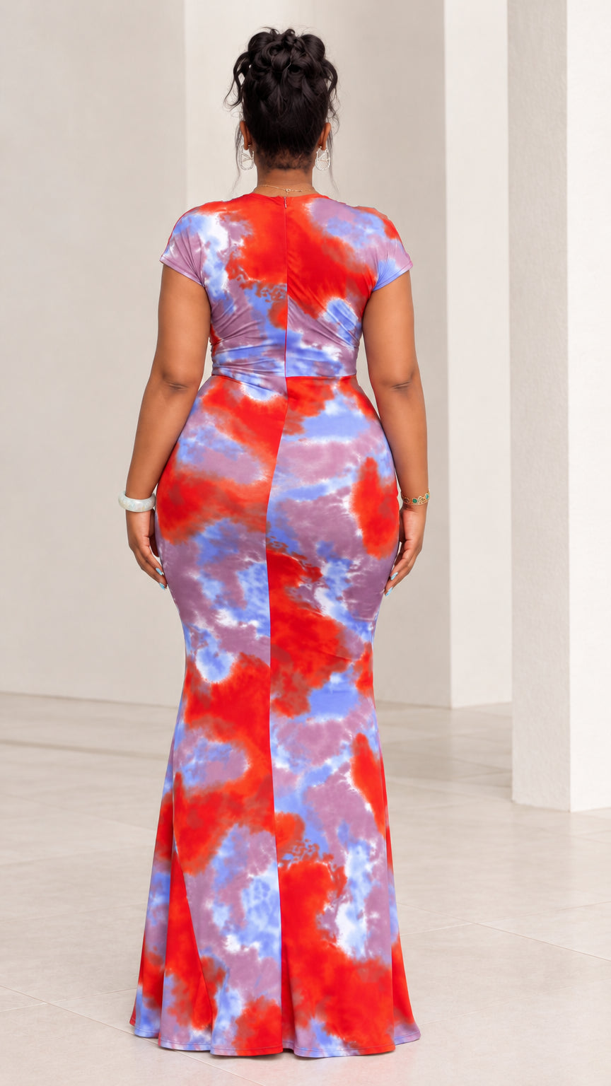 Back view of red and blue tie-dye short sleeve floor-length maxi dress