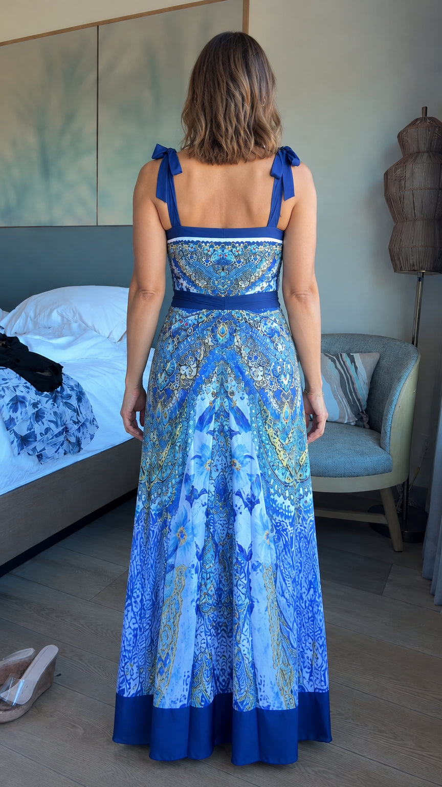 Back view of model wearing Royal Blue tie-shoulder printed maxi dress