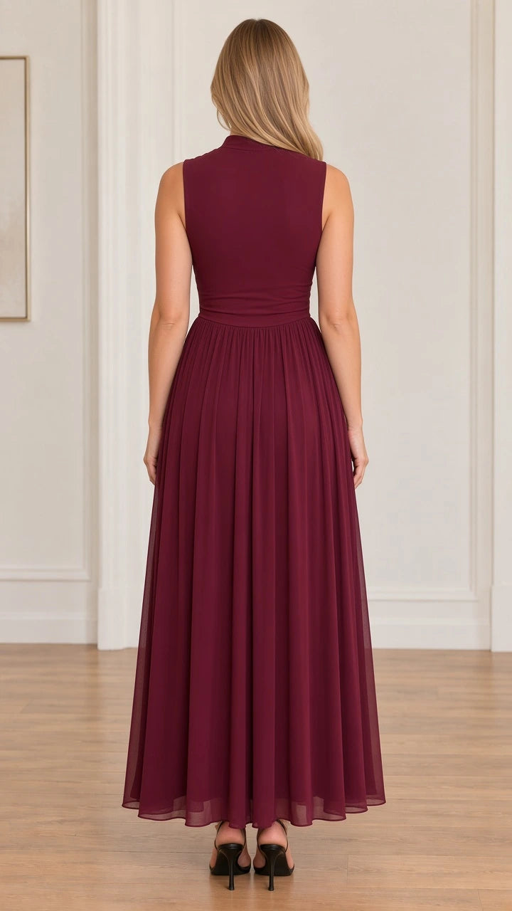 Back view of model wearing burgundy sleeveless high neck maxi dress