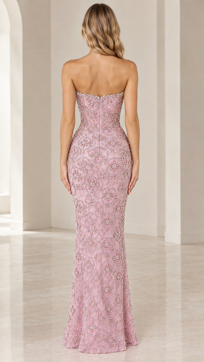 Rear view of dusty pink strapless floor-length beaded evening gown
