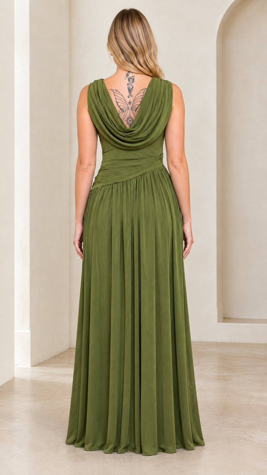 Back view of woman wearing olive green maxi dress showcasing deep draped cowl back detail