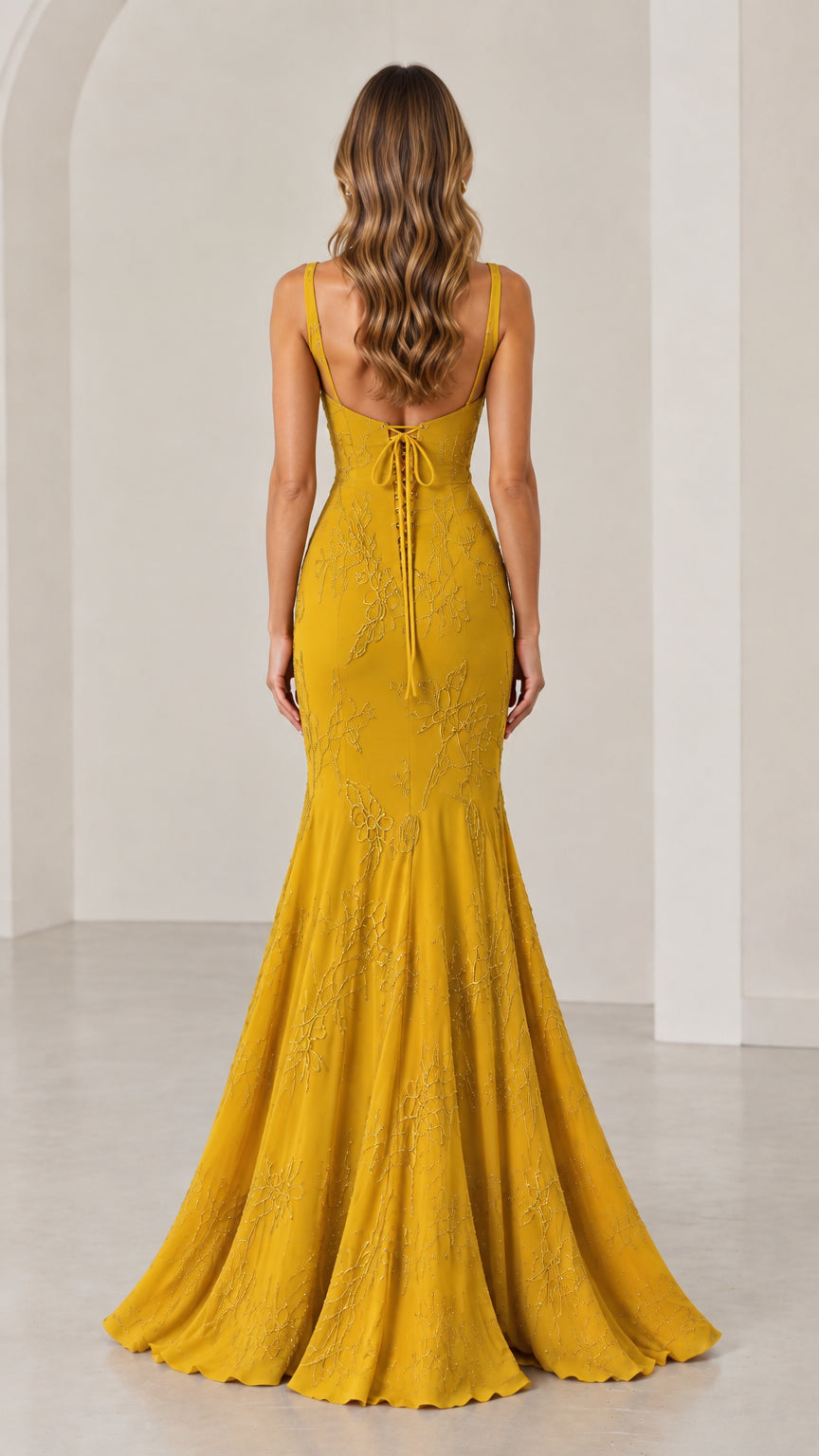 Back view of Mustard Yellow evening gown highlighting the low tie-back design