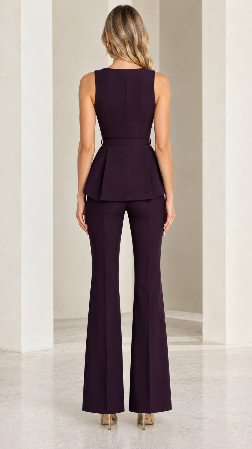 Back view of plum sleeveless peplum top and matching flared pants