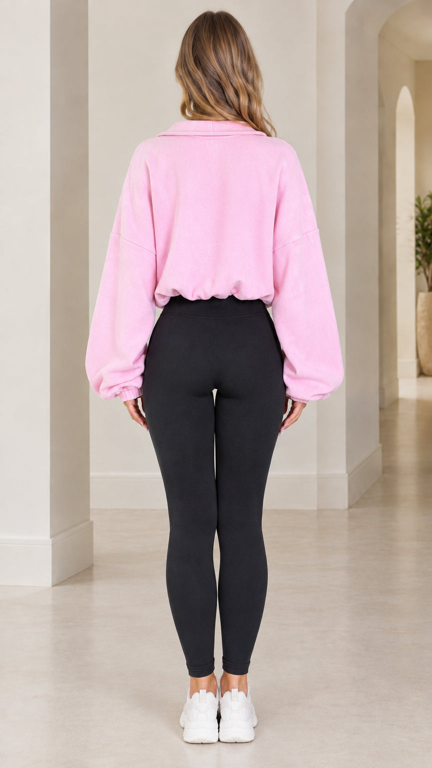 Back view of model wearing pink cropped fleece zip-up jacket