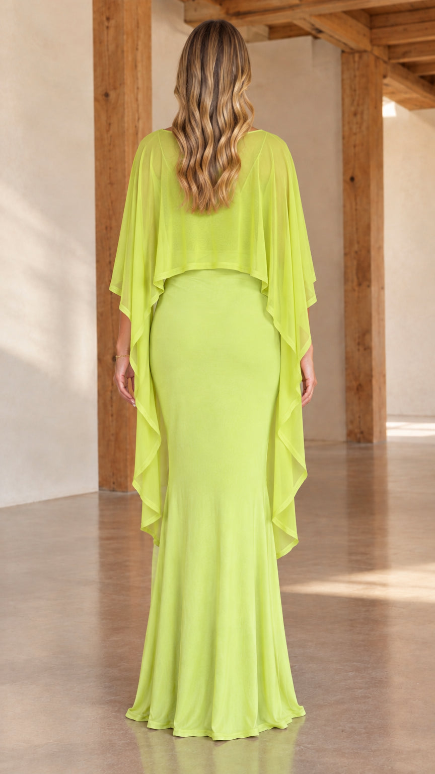 Back view of woman wearing lime green capelet overlay maxi dress showing draped cape back