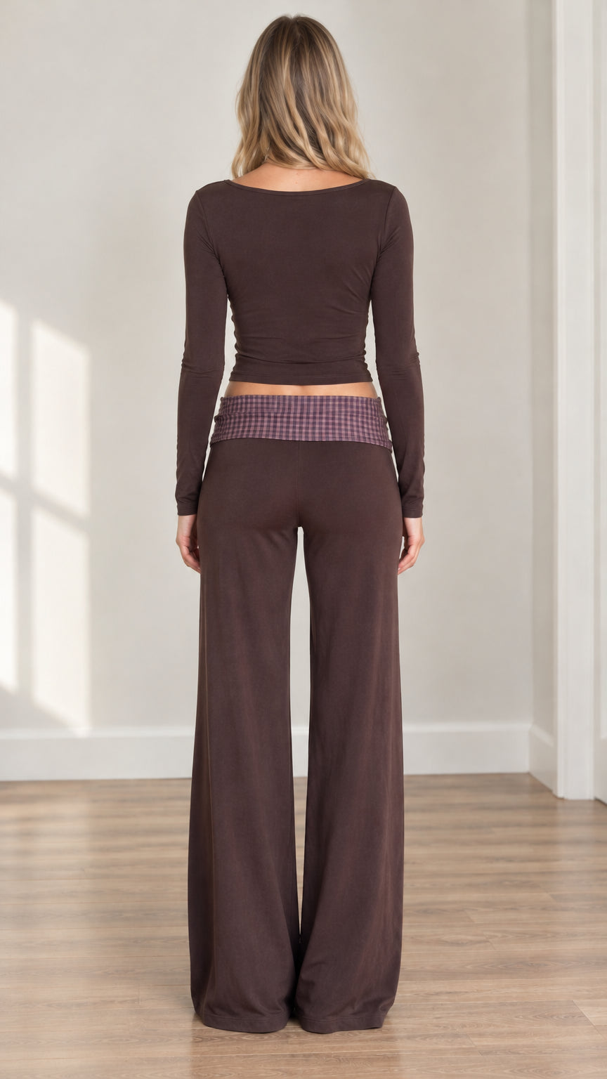 Back view of woman wearing the brown long sleeve crop top and fold-over wide leg pants