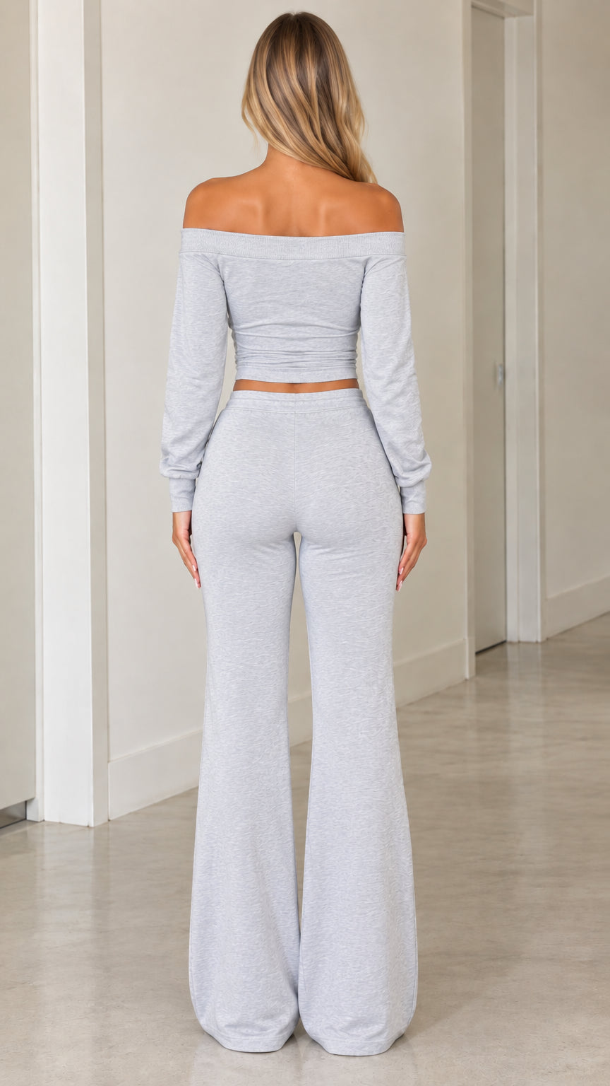 Back full view of woman wearing heather grey off-the-shoulder crop top and matching lounge pants