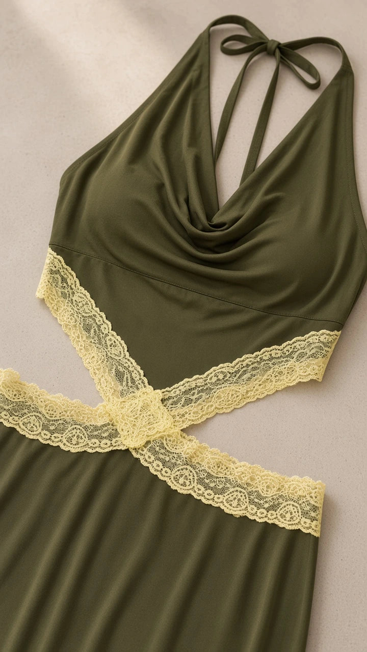Close-up flat lay of olive green cowl neckline and contrast pale yellow lace waist cutout