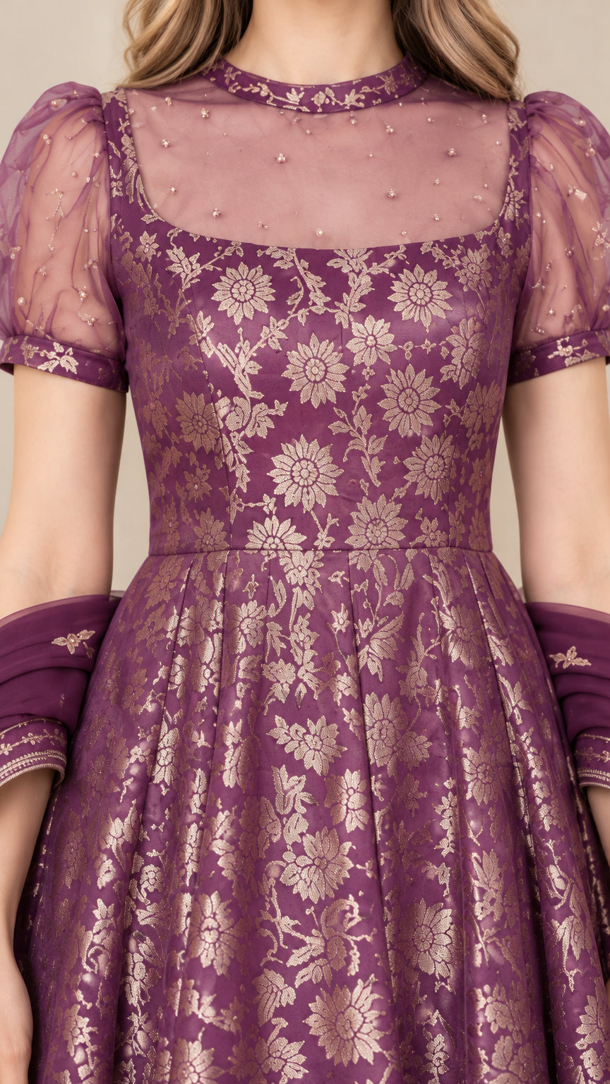 Close-up of purple floral jacquard bodice with pearl-embellished sheer illusion yoke and puff sleeve detail