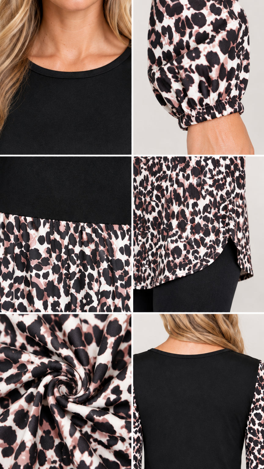 Close-up details of neckline, elastic cuffs, high-low curved hem, and soft knit fabric texture