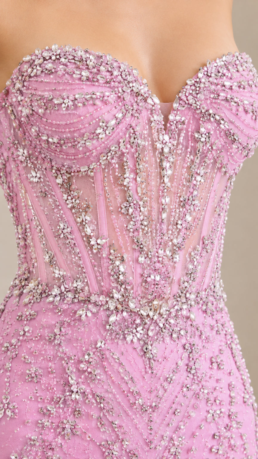 Close-up detail of sheer pink corset bodice with boning and crystal beadwork