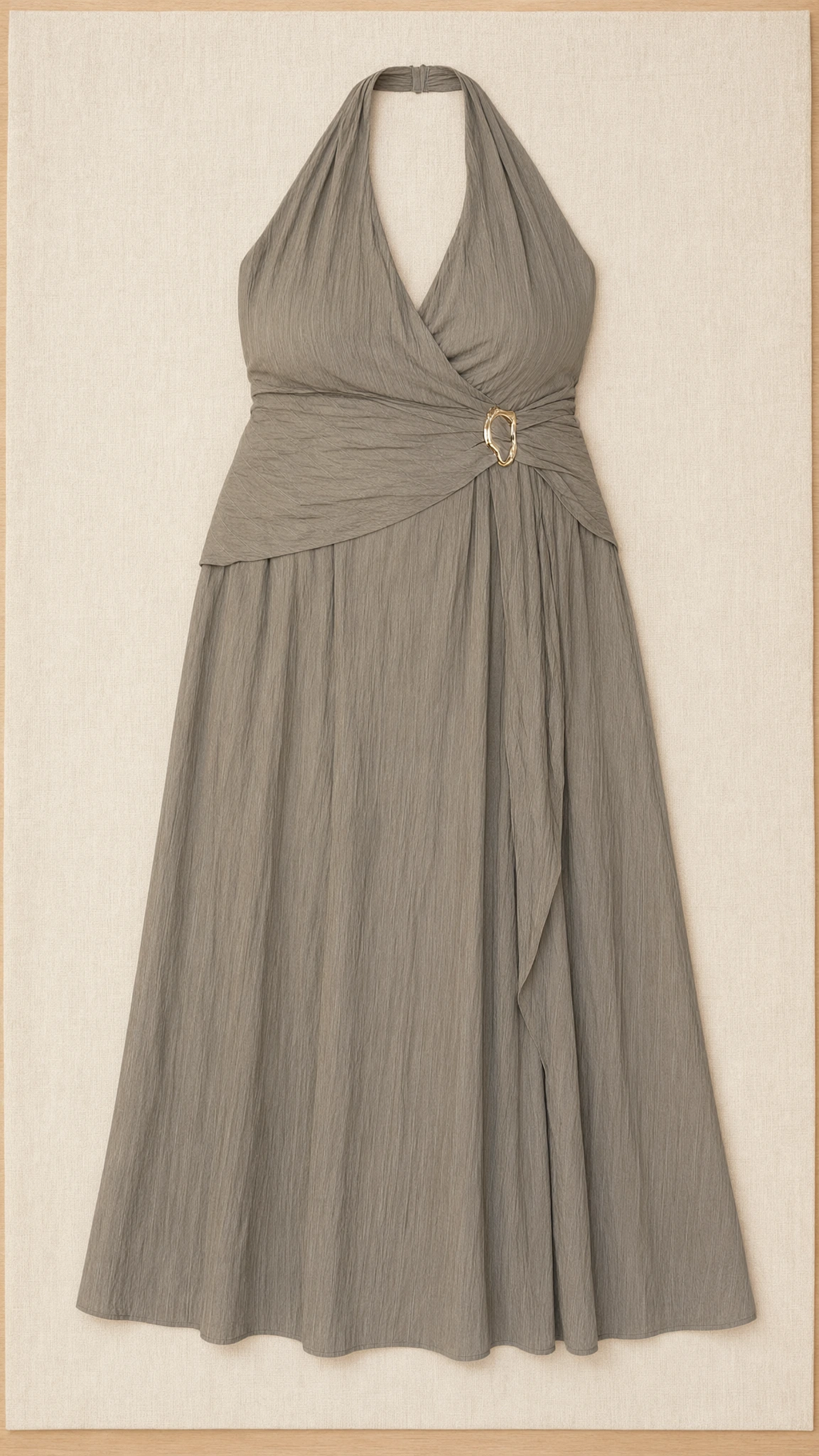 Flat lay of sage green textured halter maxi dress with side buckle ring