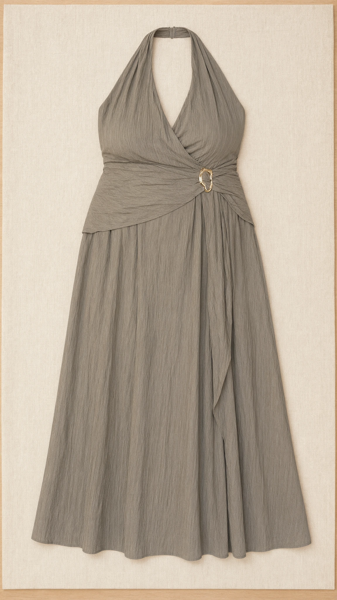 Flat lay of sage green textured halter maxi dress with side buckle ring