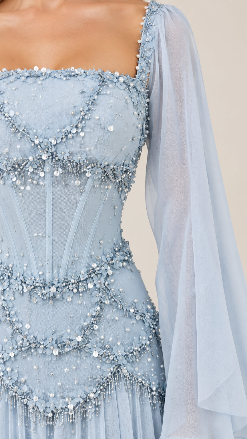 Close-up detail of embellished light blue corset bodice with beadwork swags and square neckline