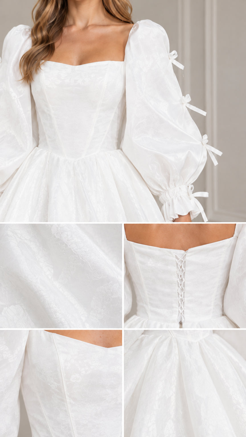 Close-up details of white gown showing square neckline, bow-adorned sleeves, and fabric texture