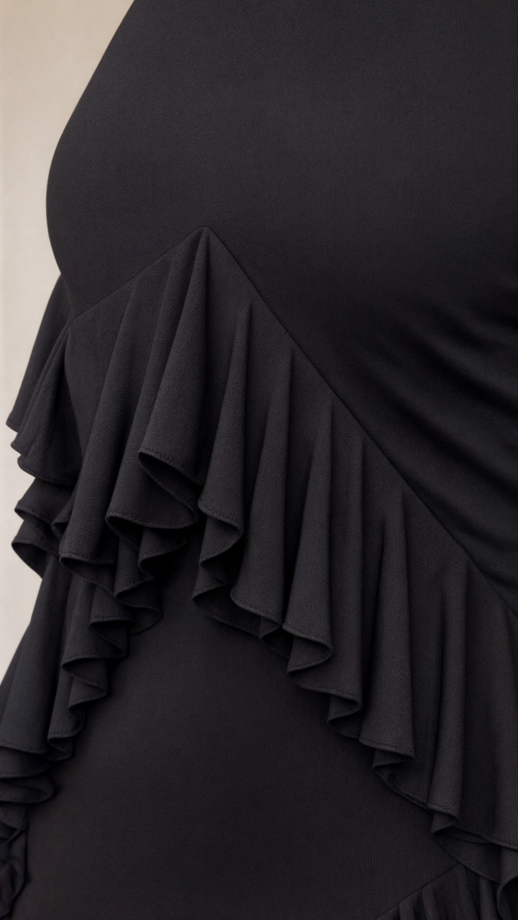 Close-up detail of tiered ruffles on smooth fabric