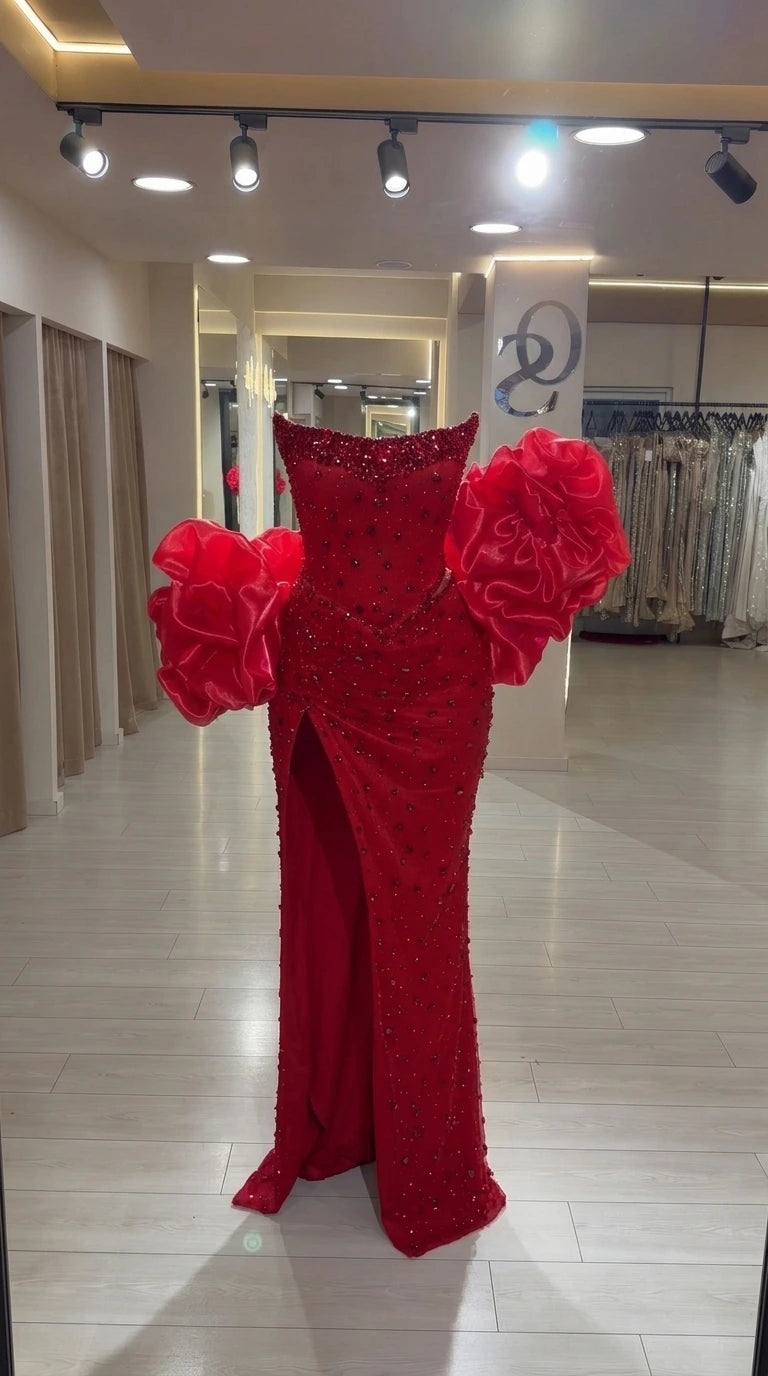 Front display of the red sequin gown showing the off-shoulder neckline and dramatic sleeves