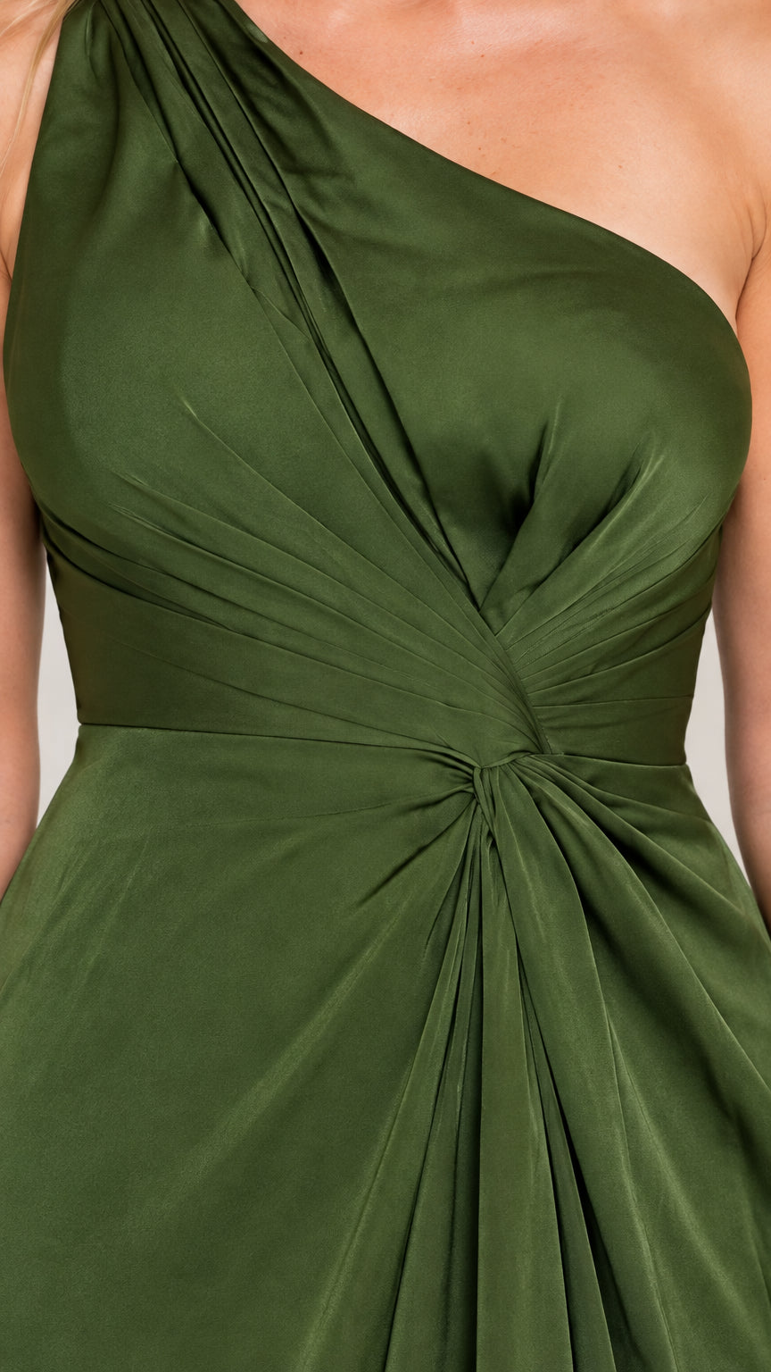 Close-up detail of one-shoulder bodice pleating and gathered waist knot
