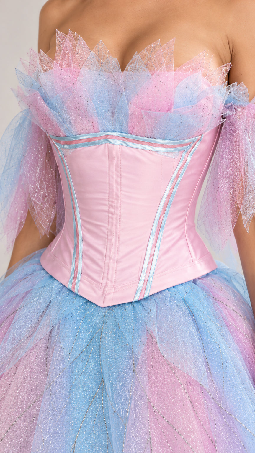 Close-up detail of structured pink boned corset with feathered blue and pink tulle