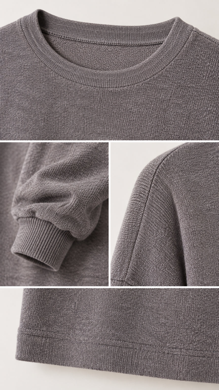 Close-up collage of neckline, cuff, shoulder seam, and hem ribbed details on charcoal grey knit pullover
