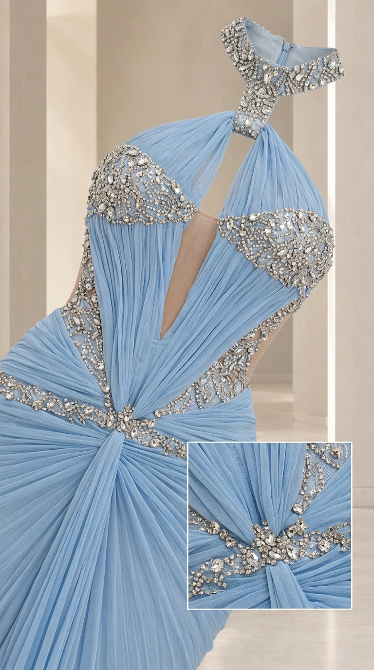 Close-up detail of rhinestone halter neckline, plunging illusion cutout, and gathered pleated bodice