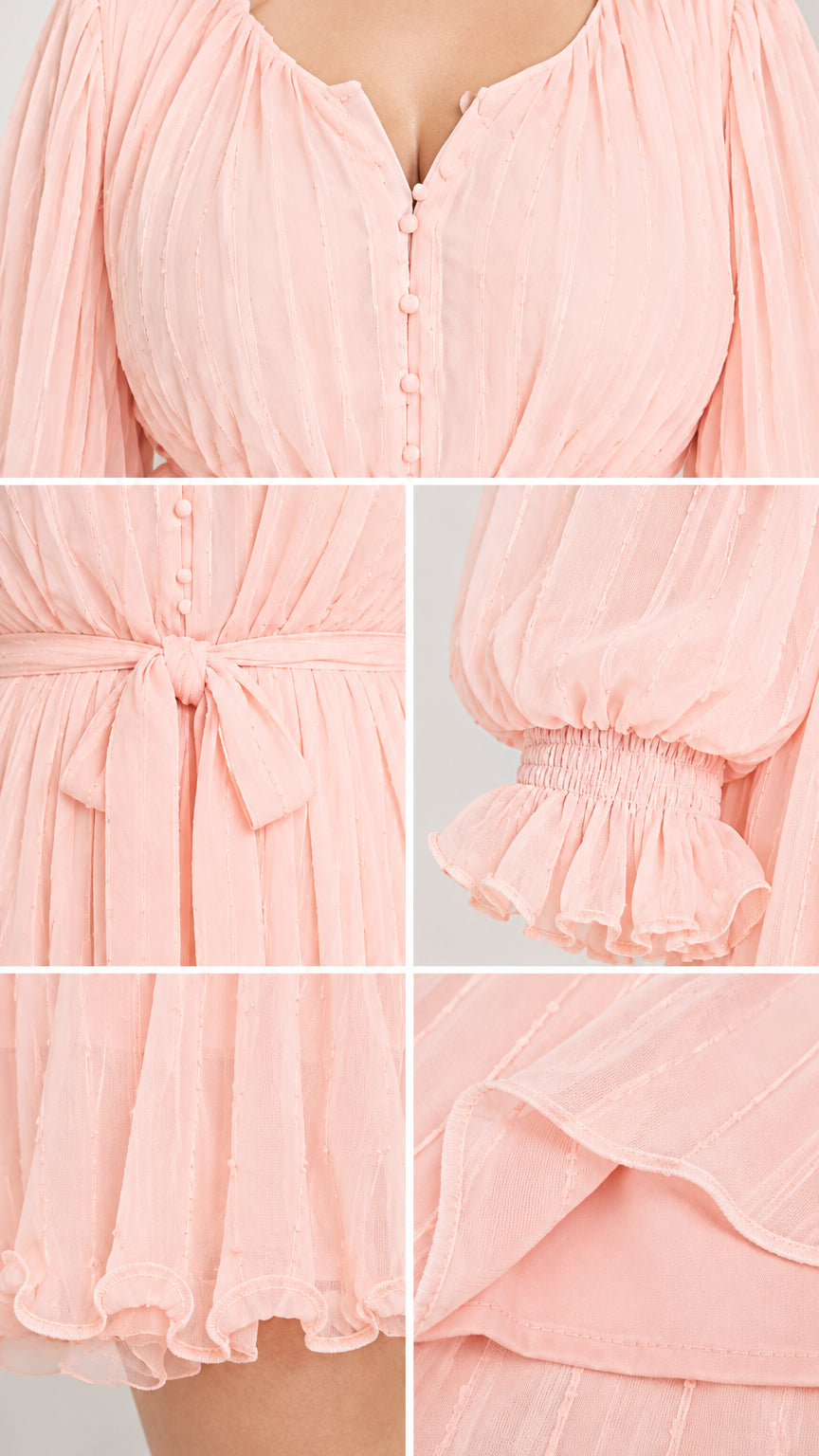 Close-up details of button neckline, waist tie sash, smocked ruffle cuffs, and hem lining