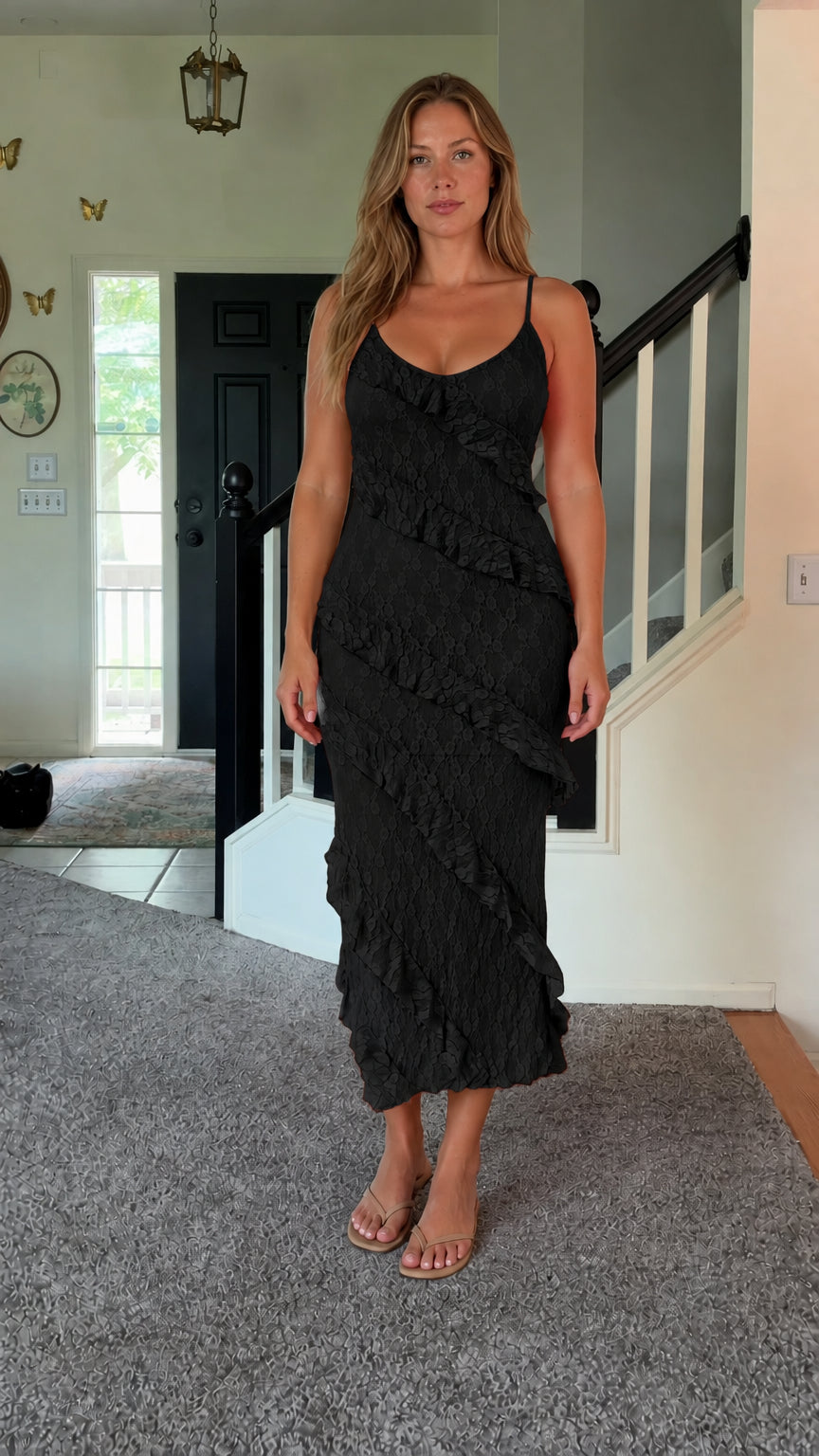 Front view of woman wearing black floral lace ruffle cami midi dress