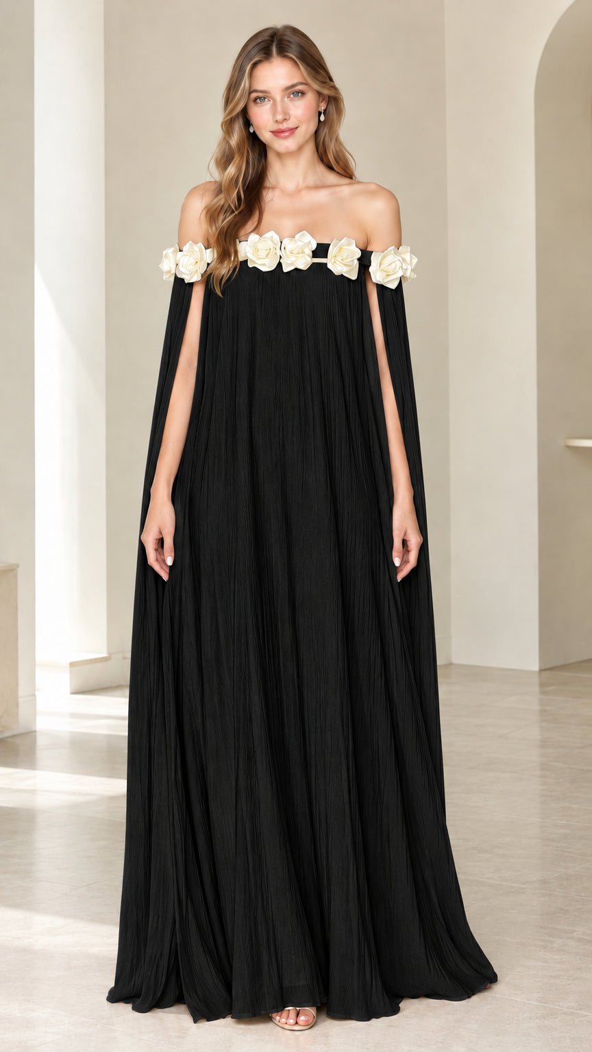 Black off-the-shoulder pleated cape maxi dress with contrasting ivory floral trim