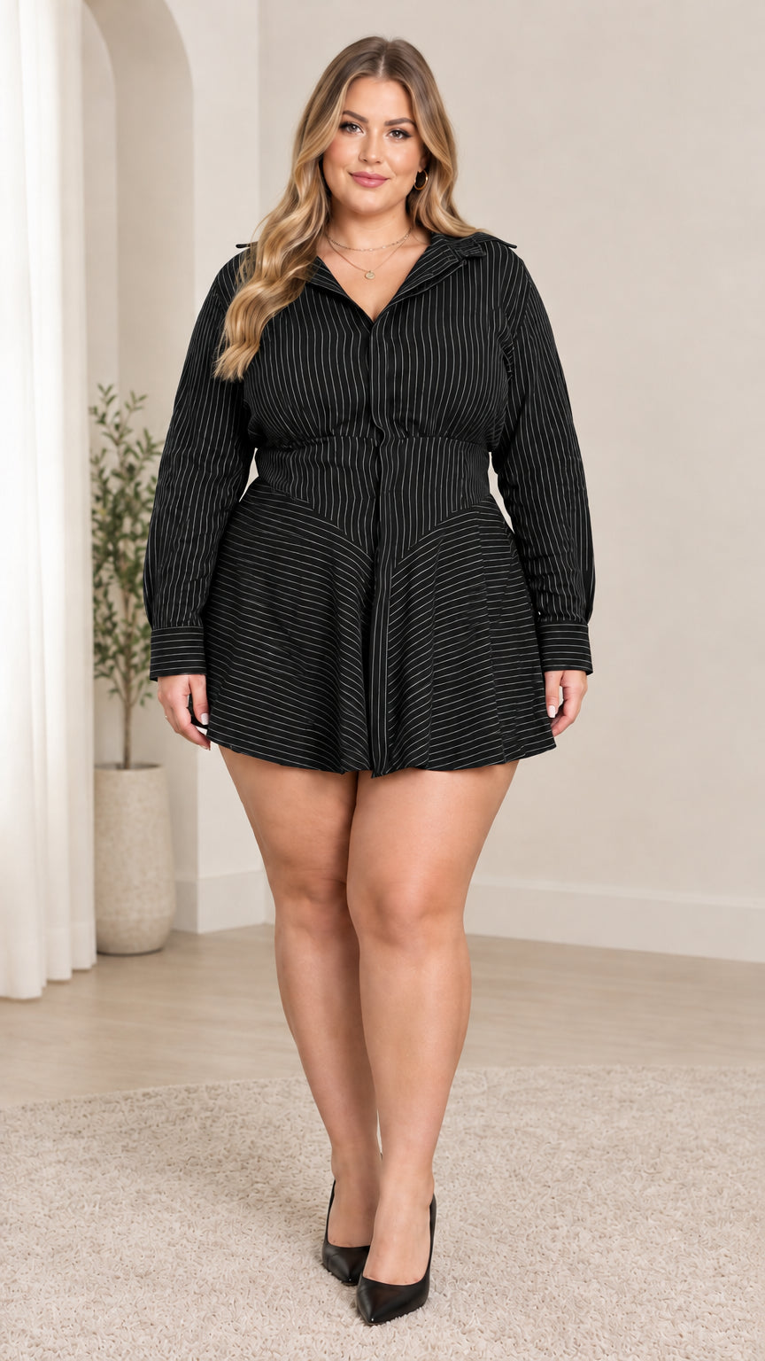 Front view of model wearing black striped long sleeve collared shirt dress