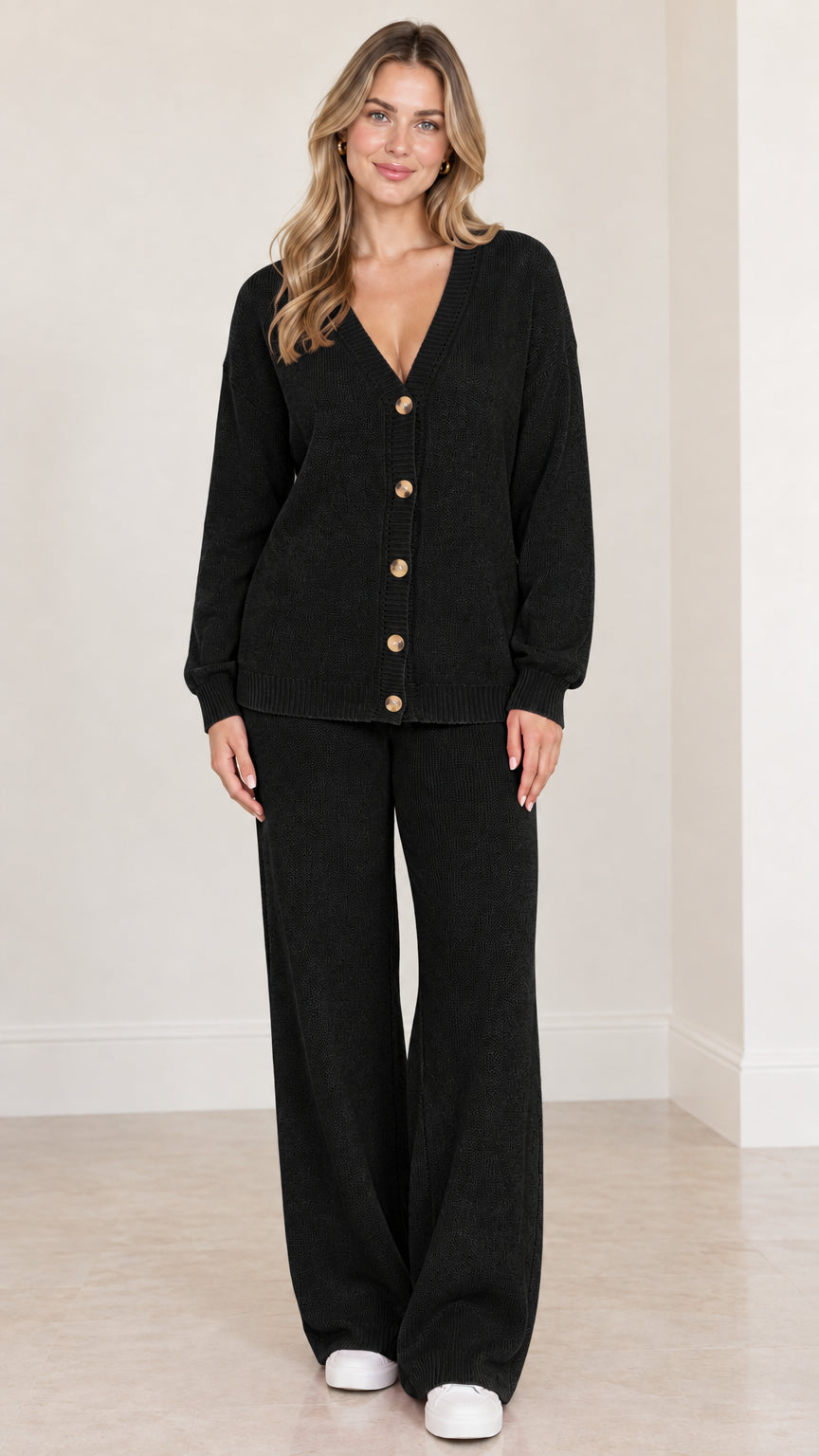 Model wearing black button-front knit cardigan and wide leg lounge pants set