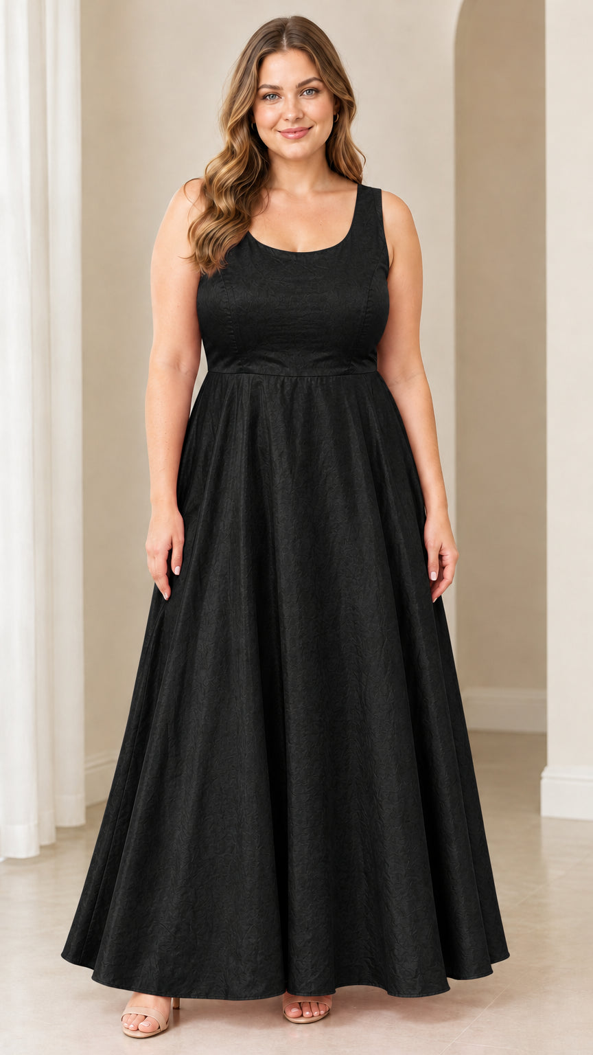 Front view of woman wearing black sleeveless scoop neck maxi evening dress